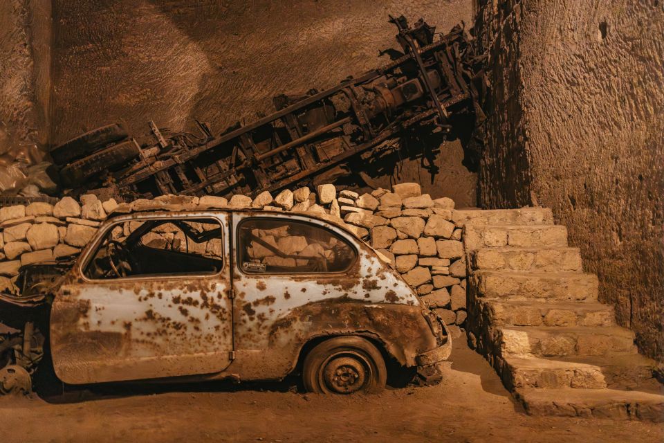 Naples: The Bourbon Tunnel Guided Tour with Entrance Ticket - Fascist-era statues and the cars-and-motorcycles display